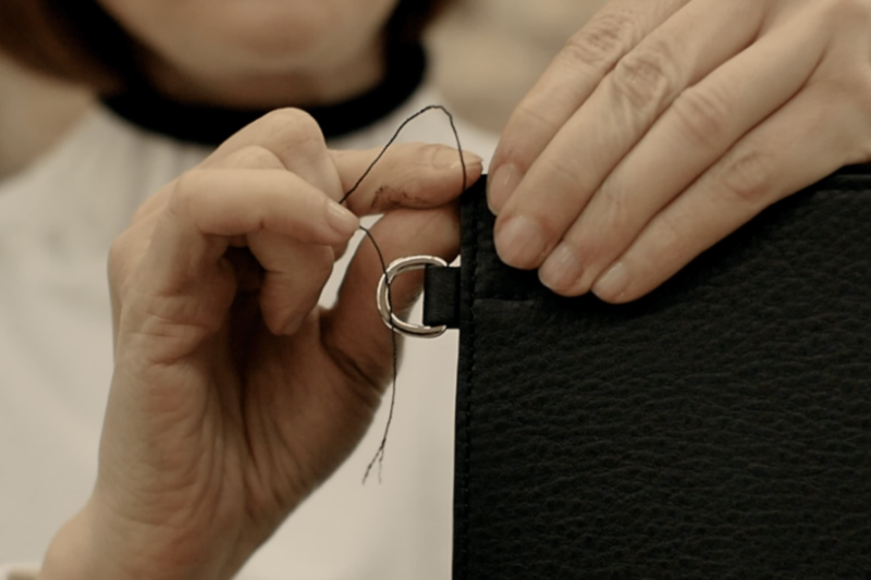 stitching a leather purse at createlab